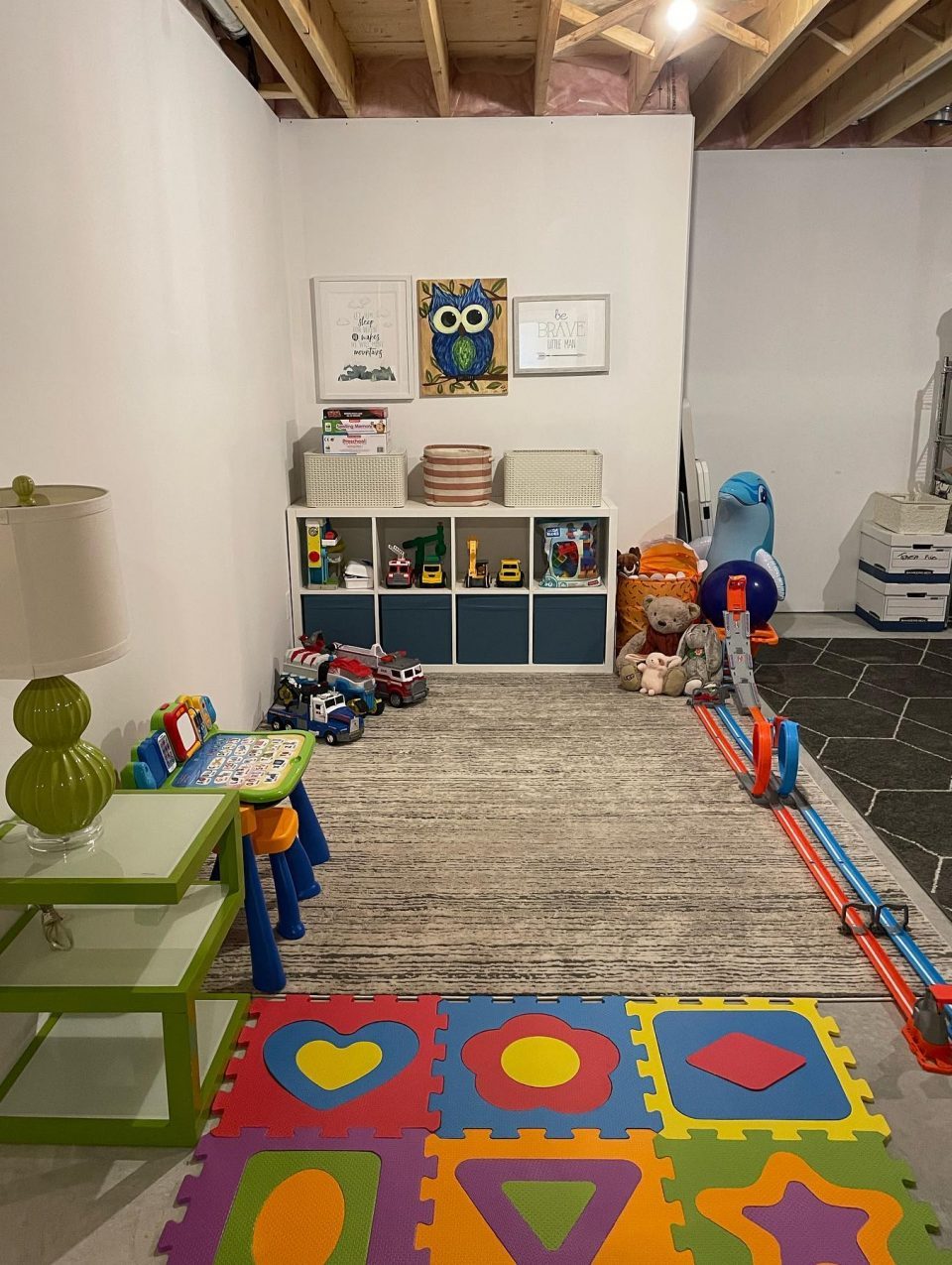 Another objective for this family was to utilize part of the large storage room space as a play space - once all of the seasonal and decor items were organized on the other side of the room, we were able to create this super sweet play space.