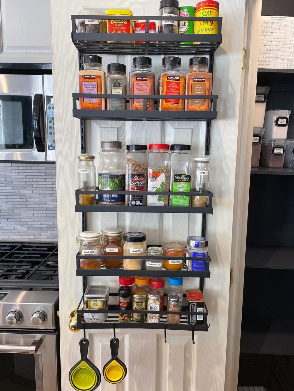 By moving the spices to a rack on the pantry door, the spices became more accessible and we freed up space for other items on the shelves.
