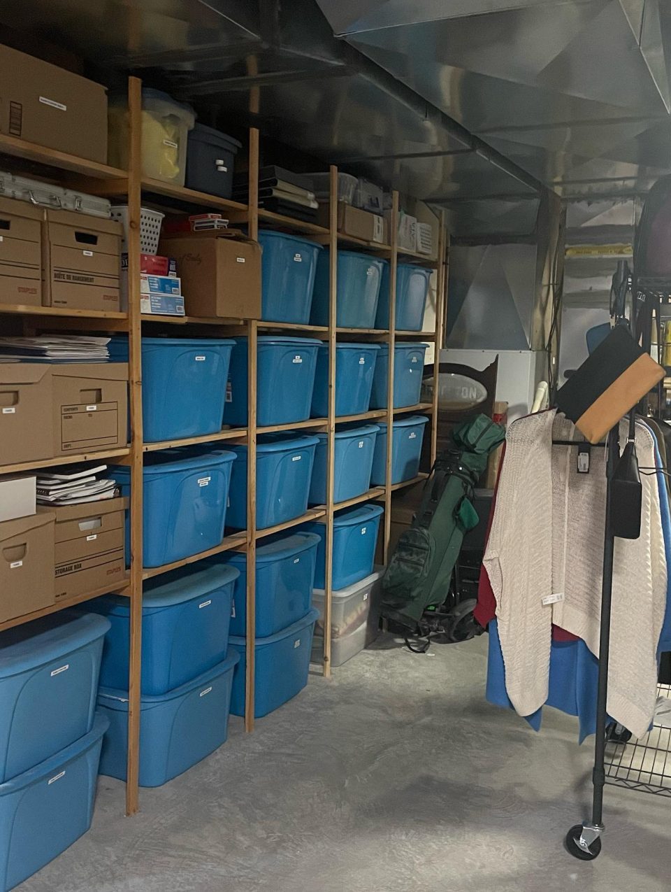 Storage Room - after lots of mindful editing and downsizing, we were able to reorganize the remaining items into the existing tote bins and reorganize them into the shelves around the room.