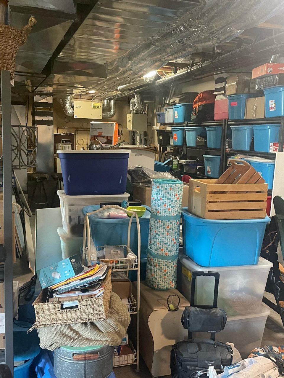 Storage Room Before - everything was everywhere - while there was great existing shelving units and bins, there was simply too much stuff and nothing was being utilized properly.